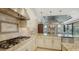 Bright kitchen with granite counters and stainless appliances with a view of the adjacent living area at 12663 Fontana Loop, Bradenton, FL 34211