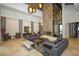 Spacious lobby featuring modern sofas, stylish lighting, and a decorative stone fireplace at 12663 Fontana Loop, Bradenton, FL 34211