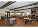 Upscale restaurant with neatly arranged tables, comfortable chairs, and a view of the golf course at 12663 Fontana Loop, Bradenton, FL 34211