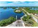 A gorgeous aerial view of the community boat ramp and trailer parking with a bay view at 264 Woods Point Rd, Osprey, FL 34229