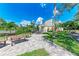 Scenic outdoor amenity area overlooking a pond and nature, complete with seating and grilling area at 264 Woods Point Rd, Osprey, FL 34229