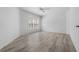 Serene bedroom features wood-look flooring, a bright window and a ceiling fan at 264 Woods Point Rd, Osprey, FL 34229