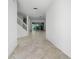 Open hallway leading to the outdoor patio with tile floors and a staircase at 264 Woods Point Rd, Osprey, FL 34229