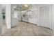 Bright open kitchen featuring a white refrigerator, tile floors, and white appliances at 264 Woods Point Rd, Osprey, FL 34229