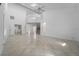 Bright and airy living room boasts vaulted ceilings, neutral tones, and tile flooring at 264 Woods Point Rd, Osprey, FL 34229