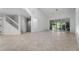 Spacious living room with tile floors, natural light, a staircase, and a ceiling fan at 264 Woods Point Rd, Osprey, FL 34229