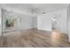 Large primary bedroom offers wood flooring, access to bath, and sliding door to lanai at 264 Woods Point Rd, Osprey, FL 34229