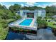 Community pool with surrounding deck and lounge chairs at 264 Woods Point Rd, Osprey, FL 34229
