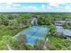 Well-maintained tennis courts nestled within a vibrant community at 264 Woods Point Rd, Osprey, FL 34229