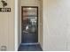 Front door with black frame and tile landing outside the entryway at 5071 Village Gardens Dr # 5, Sarasota, FL 34234