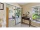 Light-filled hallway featuring a slider to the lanai and charming decor at 5071 Village Gardens Dr # 5, Sarasota, FL 34234