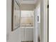 Practical laundry room featuring a washer and dryer and storage shelves at 5071 Village Gardens Dr # 5, Sarasota, FL 34234