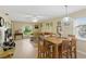 Open concept living and dining area featuring wood floors and natural light at 5071 Village Gardens Dr # 5, Sarasota, FL 34234