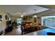Bright living room with lots of windows and a comfortable seating arrangement with a dining table at 5071 Village Gardens Dr # 5, Sarasota, FL 34234