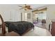 Light bedroom with fan, access to screened lanai, and closet space at 5071 Village Gardens Dr # 5, Sarasota, FL 34234