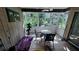 Enclosed sun room featuring tile floors, paneled walls and lots of natural light at 5071 Village Gardens Dr # 5, Sarasota, FL 34234