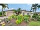 Single-Gathering home with tile roof, landscaping, and a two-car garage at 12663 Fontana Loop, Bradenton, FL 34211