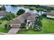 Single-Gathering home with tile roof, landscaping, and a view of a lake at 12663 Fontana Loop, Bradenton, FL 34211