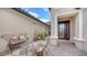 A courtyard with a seating area, potted plants, and a glass-paned door at 12663 Fontana Loop, Bradenton, FL 34211