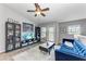 Living room with vaulted ceiling, hardwood floors, and blue sofa at 8905 Manor Loop # 205, Lakewood Ranch, FL 34202