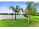 Tranquil lake view with lush green landscaping at 8905 Manor Loop # 205, Lakewood Ranch, FL 34202