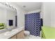 Clean bathroom with shower/tub and patterned curtain at 8905 Manor Loop # 205, Lakewood Ranch, FL 34202