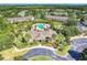 Community clubhouse with pool and surrounding landscape at 8905 Manor Loop # 205, Lakewood Ranch, FL 34202