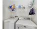 Laundry room with Maytag washer and dryer, and shelving at 8905 Manor Loop # 205, Lakewood Ranch, FL 34202