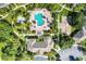 Aerial view of community pool, clubhouse, and playground at 8905 Manor Loop # 205, Lakewood Ranch, FL 34202
