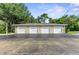 Four-car garage with ample parking space at 8905 Manor Loop # 205, Lakewood Ranch, FL 34202