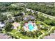 Aerial view of community pool, clubhouse, and grounds at 8905 Manor Loop # 205, Lakewood Ranch, FL 34202