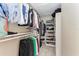 Walk-in closet with ample shelving and hanging space for clothes and shoes at 8905 Manor Loop # 205, Lakewood Ranch, FL 34202