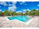 Inviting community pool with steps and patio at 8905 Manor Loop # 205, Lakewood Ranch, FL 34202