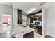 Modern kitchen with granite countertops and dark wood cabinets at 8905 Manor Loop # 205, Lakewood Ranch, FL 34202