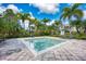 Community spa with lounge chairs and surrounding landscaping at 8905 Manor Loop # 205, Lakewood Ranch, FL 34202