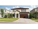 Two-story house with a brown roof and attached garage at 8822 Windlass Cv, Parrish, FL 34219