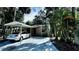 Single-Gathering home with carport and lush tropical landscaping at 5071 Village Gardens Dr # 5, Sarasota, FL 34234