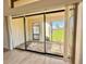 Sliding doors reveal a backyard oasis with a relaxing rock garden at 5331 87Th W St, Bradenton, FL 34210