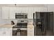 Stainless steel appliances and white cabinets at 5018 25Th E St, Bradenton, FL 34203