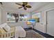 Bright sunroom with water views, comfy daybed, and large TV at 5018 25Th E St, Bradenton, FL 34203