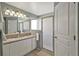 Bathroom with double vanity, large mirror, and separate shower at 5018 25Th E St, Bradenton, FL 34203