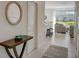 Bright and airy entryway with view into the living room at 5725 Haven Ter, Nokomis, FL 34275
