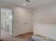 Upstairs hallway with double doors and bench at 5725 Haven Ter, Nokomis, FL 34275