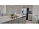 Kitchen island with double sink and stainless steel appliances at 5725 Haven Ter, Nokomis, FL 34275