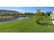 Spacious backyard with pond view and lush green grass at 5725 Haven Ter, Nokomis, FL 34275