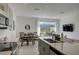 Modern kitchen with stainless steel appliances, a large island, and plenty of counter space at 5725 Haven Ter, Nokomis, FL 34275
