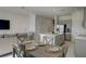 Open concept dining area with a light grey table and chairs, near the kitchen at 5725 Haven Ter, Nokomis, FL 34275