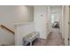 Upstairs hallway with bench and access to bedrooms and office at 5725 Haven Ter, Nokomis, FL 34275