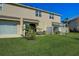 Private backyard with patio furniture and green lawn at 5725 Haven Ter, Nokomis, FL 34275