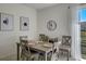 Bright dining area with a grey table and four chairs, perfect for Gathering meals at 5725 Haven Ter, Nokomis, FL 34275